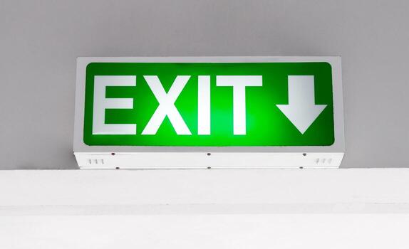 geen emergency exit sign with downward arrow mounted on ceiling, symbolizing safety and evacuation in buildings, emergency exit sign for indicating fire escape route and emergency photo