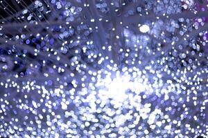 bokeh abstract blue circle star bokeh lights festival with black background photo