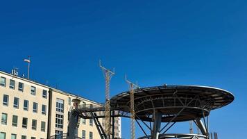 A building with a large metal structure on top video