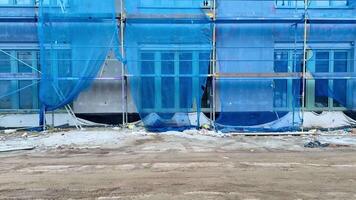 A building with blue tarp covering it video
