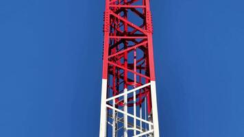 A striking transmission tower showcasing advanced communication technology against a vibrant blue sky video