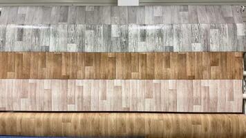 A large roll of wood paneling in a store video