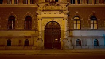 A building with a large door and windows at night video