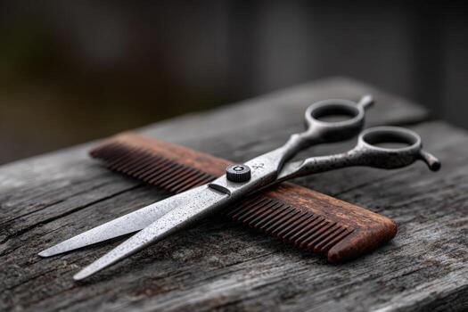 Barber tools, scissors and comb, lie on old wood photo