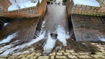 A view of a waterway with water flowing over it video