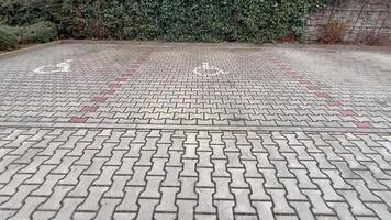 A parking lot with two handicap parking spaces video