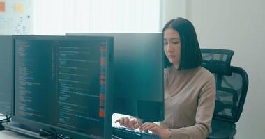 Group Adult Asia male, female freelance typing write prompt AI bot IT app smart program nomad, game, terminal with coding language, user interface, designer, big data center desktop computer. video
