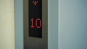 Elevator display with numbers in lightning red, going down. Close-Up of digital lift monitor showing floor number. video