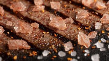 Delicious Grilled Meat Close Up With Coarse Salt and Spices. photo