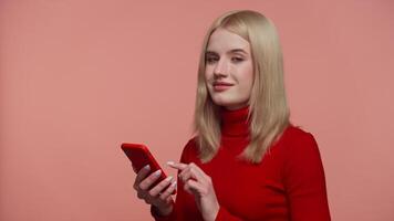 Woman Nodding and Scrolling on Smartphone While Smiling video
