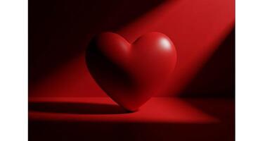 Red heart illuminated by dramatic spotlighting against a dark background photo