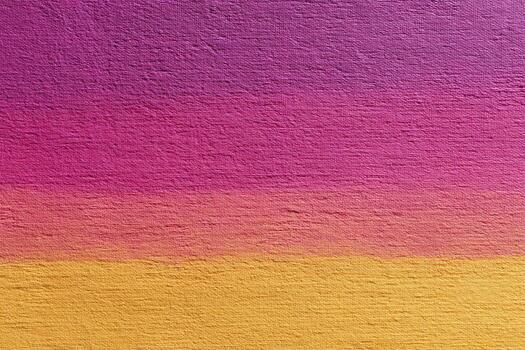 Gradient textured wall with vibrant pink, purple, and yellow colors creating warm and artistic background with rough surface details photo
