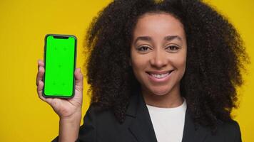 Smiling Woman Nods in Approval Holding Green Screen Smartphone video