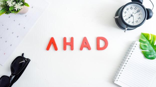 Flat lay composition with red color foam letters spelling word sunday in Indonesian, AHAD isolated on white background photo