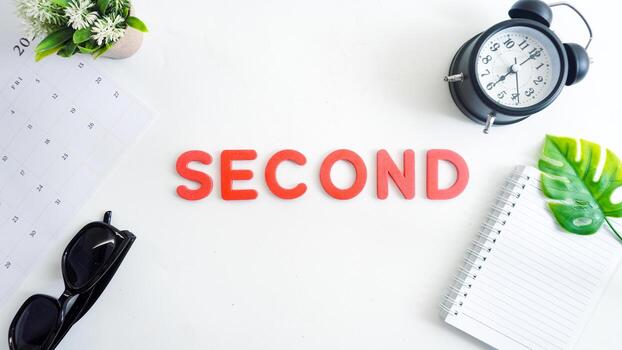 Flat lay composition with red color foam letters spelling word SECOND isolated on white background photo