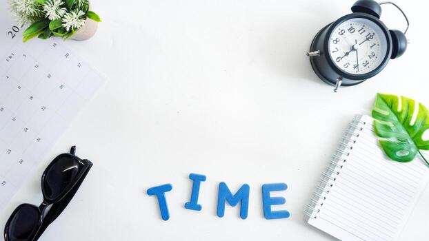 Flat lay composition with blue color foam letters spelling text TIME isolated on white background photo