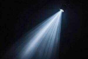 A spotlight is shining on a black background photo