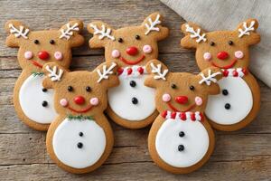Reindeer shaped gingerbread cookies celebrating christmas with a snowman pattern photo