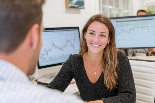 Smiling financial advisor consulting client showing positive data on computer screen photo