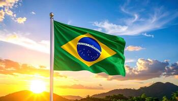 Brazilian flag waving proudly on a flagpole against a vibrant sunset sky over mountains. Features the motto Ordem e Progresso. Symbol of Brazilian patriotism, culture, and pride. photo