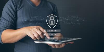 Cybersecurity and privacy concepts to protect data. Lock icon and internet network security technology. Businessman protecting personal data on laptop with virtual screen interfaces. photo
