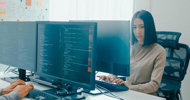 Group Adult Asia male, female freelance typing write prompt AI bot IT app smart program nomad, game, terminal with coding language, user interface, designer, big data center on desktop computer photo