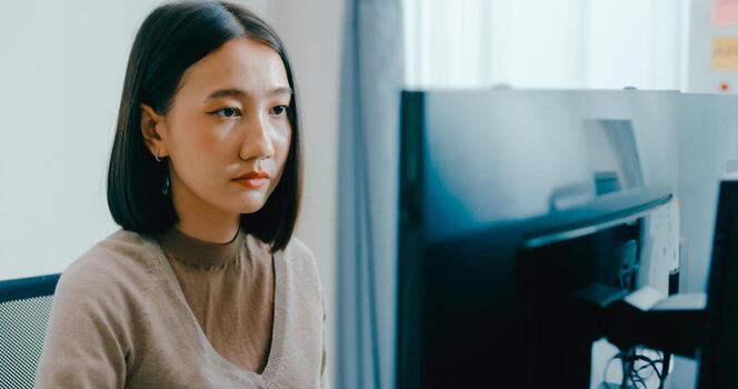 Young Asia female freelance typing write prompt AI bot IT app smart program nomad, game, terminal with coding language, user interface, designer, big data center on desktop computer. photo