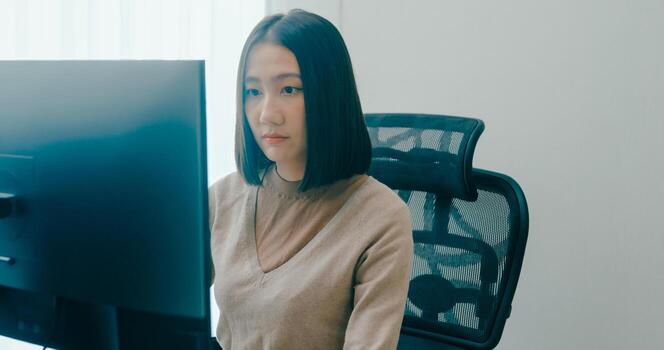 Young adult Asia female typing write prompt AI bot IT app smart program nomad, game, terminal with coding language, user interface, designer, big data center on desktop computer. photo