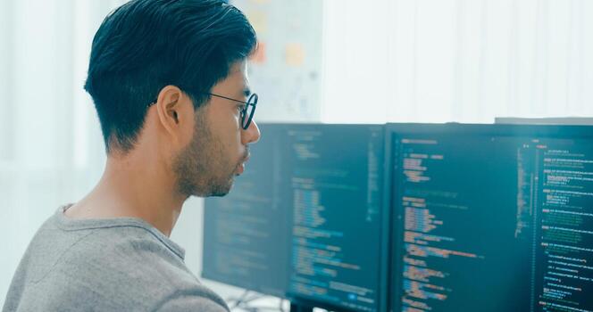 Closeup young adult Asia male freelance typing write prompt AI bot IT app program nomad, game, terminal with coding, user interface, designer, big data center on desktop computer. photo