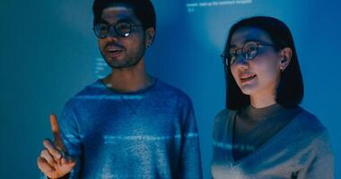 Group adult Asia male female software developers mentor leader manager talk strategy plan to executive write prompt AI bot IT app program nomad, data center. Projecting code photo