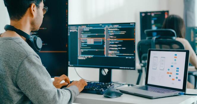 Closeup Asia male, female freelance typing write prompt AI bot IT app smart program nomad, game, terminal with coding language, user interface, designer, data center desktop computer photo