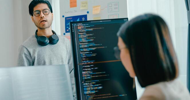 Group adult Asia male female software developers mentor leader manager talk strategy plan to executive write prompt AI bot IT app program nomad, data center. Whiteboard code photo