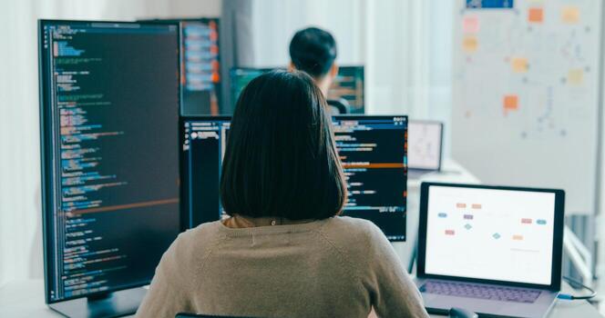 Asia male, female freelance typing write prompt AI bot IT app smart program nomad, game, terminal with coding language, user interface, designer, big data center on desktop computer. photo