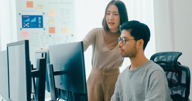 Group Adult male, female freelance meeting write prompt AI bot IT app smart program nomad, game, talk strategy, discuss plan, user interface, designer, big data center on desktop computer. photo