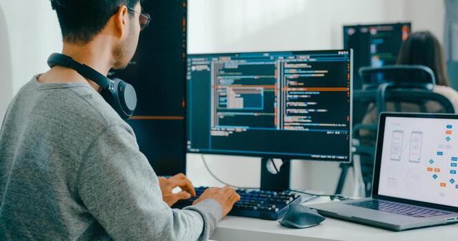 Closeup Asia male, female freelance typing write prompt AI bot IT app smart program nomad, game, terminal with coding language, user interface, designer, big data center desktop computer. photo