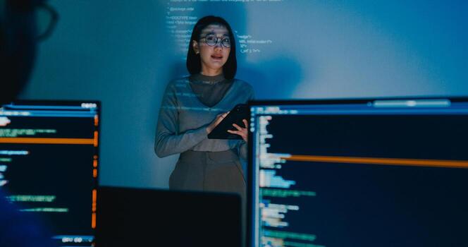 Group Asia female software developer mentor leader manager talk strategy plan to executive write prompt AI bot IT app program nomad, data center. Projecting slideshow code photo