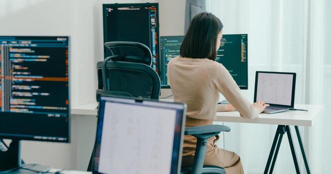 Adult female freelance typing write prompt AI bot IT app smart program nomad, game, terminal with coding language, user interface, designer, big data center on desktop computer. photo