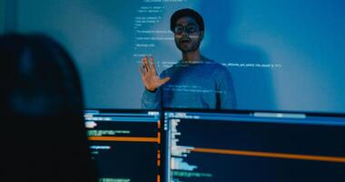 Group Asia male software developers mentor leader manager talk strategy plan to executive write prompt AI bot IT app program nomad, designer, data center. Projecting slideshow code photo
