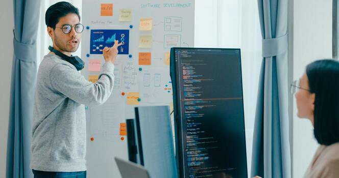 Group Asia male female software developers mentor leader manager talk strategy plan to executive write prompt AI bot IT app program nomad, game, data center. Whiteboard slideshow code. photo