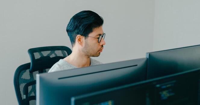 Young male freelance typing write prompt AI bot IT app smart program nomad, game, terminal with coding, user interface, designer, big data center on desktop computer. photo