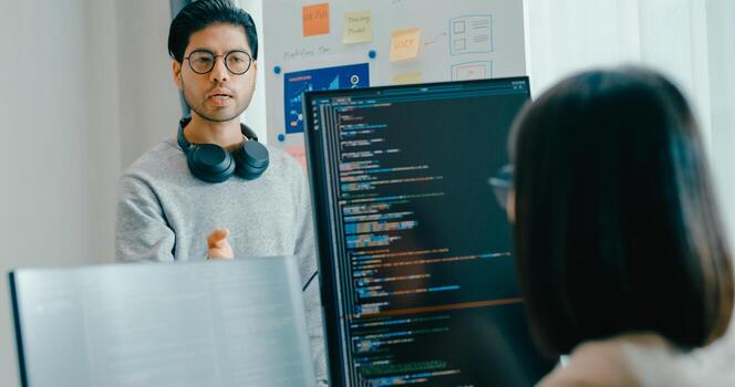 Group adult male female software developers mentor leader manager talk strategy plan to executive write prompt AI bot IT app program nomad, game, data center. Whiteboard slideshow code. photo