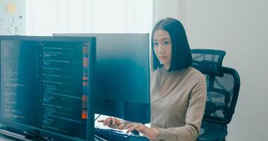 Young Asia female freelance write prompt AI bot app smart program nomad, game, terminal with coding language, user interface, designer, big data center on desktop computer. photo