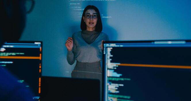 Group Asia female software developer mentor leader manager talk strategy plan to executive write prompt AI bot IT app program nomad, designer, data center. Projecting slideshow code photo