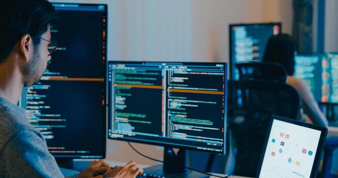 Group Adult Asia male, female freelance typing write prompt AI bot IT app smart program nomad, game, terminal with coding language, designer, big data center on desktop computer in night office photo