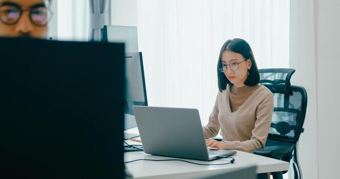 Group Asia male, female freelance typing write prompt AI bot IT app smart program nomad, game, terminal with coding language, user interface, designer, data center on desktop computer photo