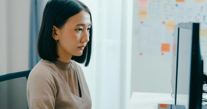 Young Asia female freelance write prompt AI bot IT app smart program nomad, game, terminal with coding language, user interface, designer, big data center on desktop computer. photo