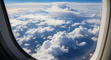 An airplane window view of clouds and sky photo