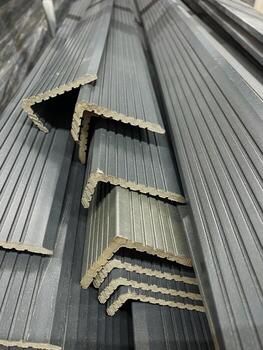 Metal angles, designed for construction, are neatly stacked for easy access and quick retrieval, ensuring efficiency and convenience for various projects and applications photo