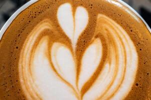 The surface of hot latte coffee. A latte is a coffee drink made with espresso and steamed milk. photo