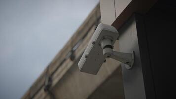 The Outdoor Surveillance Camera is expertly Mounted on the Wall for enhanced security purposes video